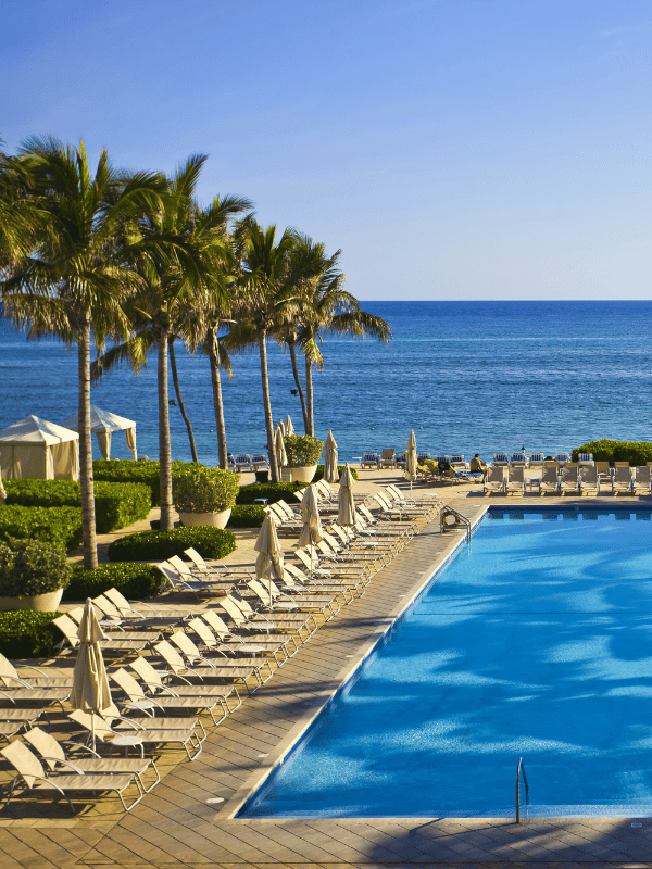 Palm tree-lined pool by the ocean in Montego Bay, Jamaica