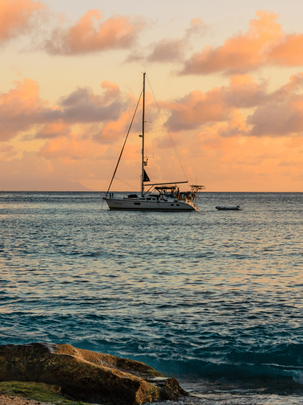 A sailboat at sunset off the coast of St Barths