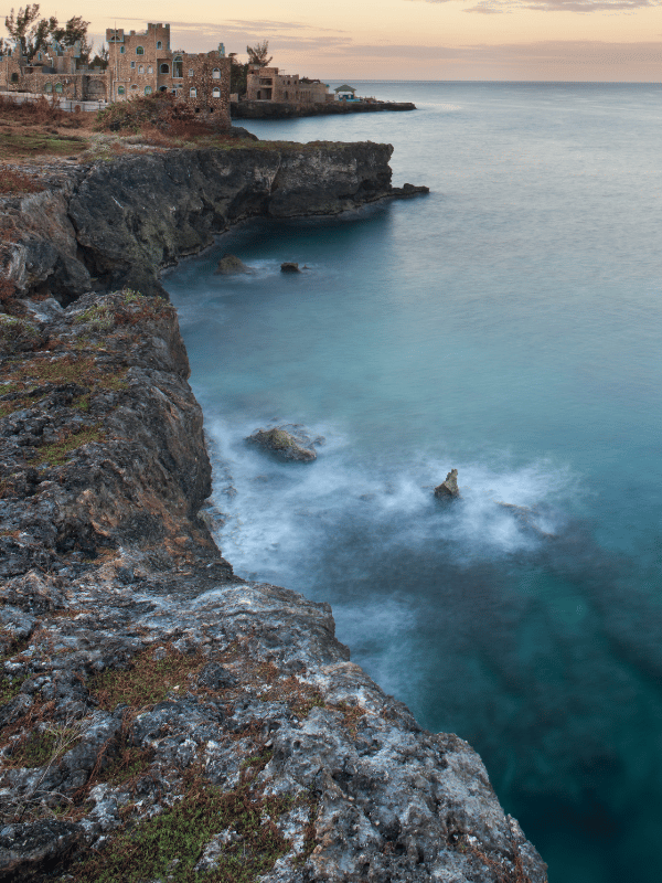 Rocky shoreline at sunset in Negril