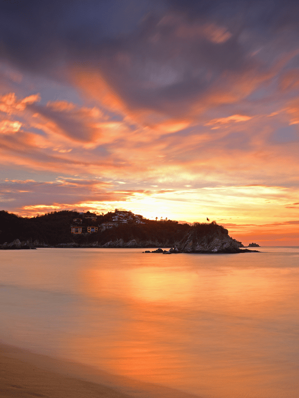 Colorful sunset on the shore in Huatulco, Mexico