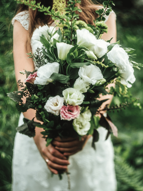 Close-up of a bride holding a bouquet of flowers