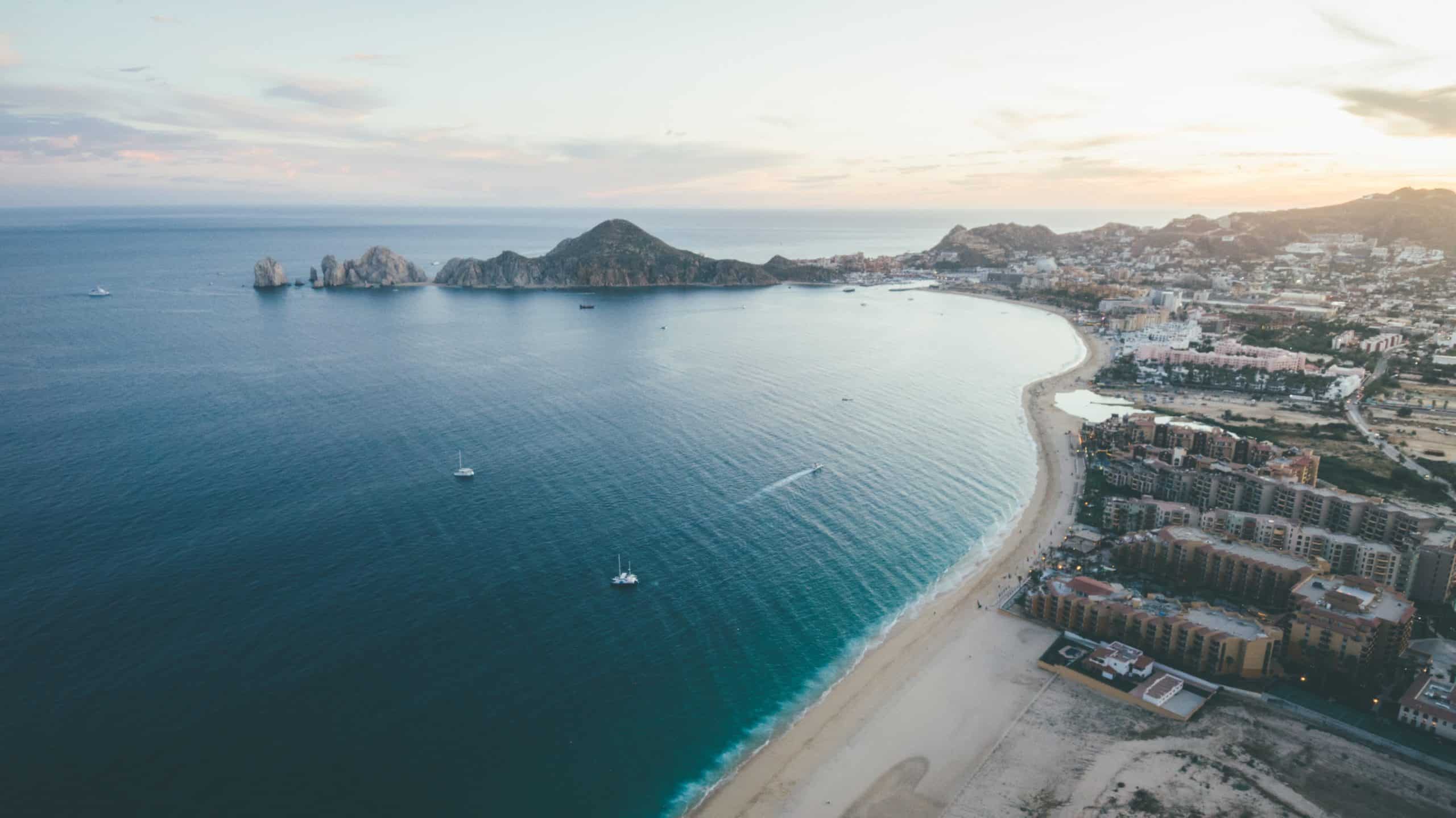 Aerial photo of beachside resorts in Cabo San Lucas.