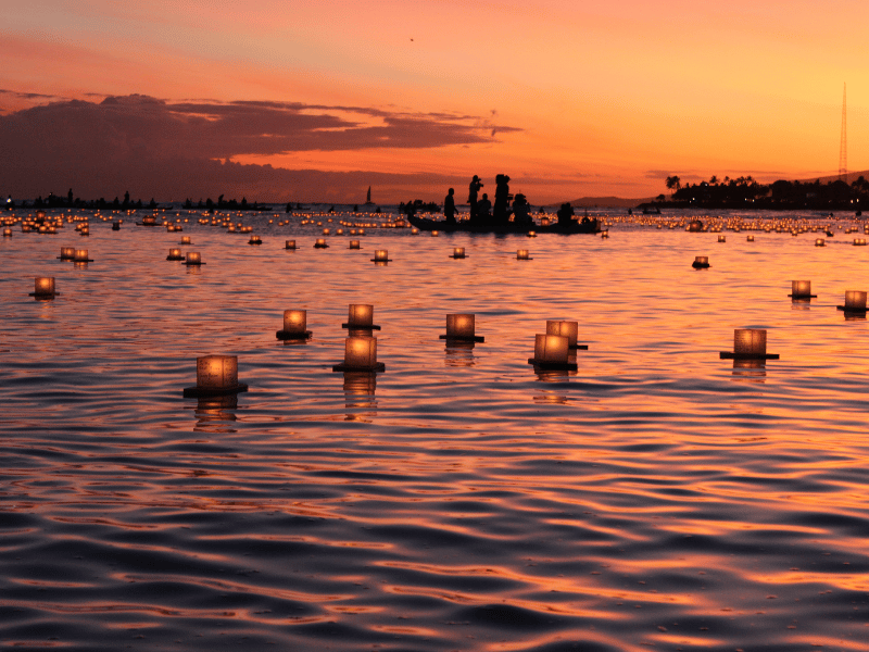 Lanterns on the water at sunset in Oahu, Hawaii