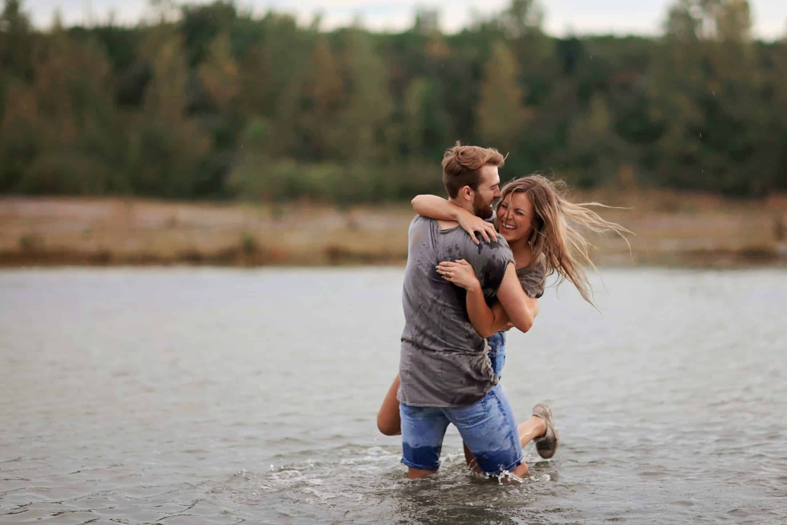 A couple embraces in a lake.