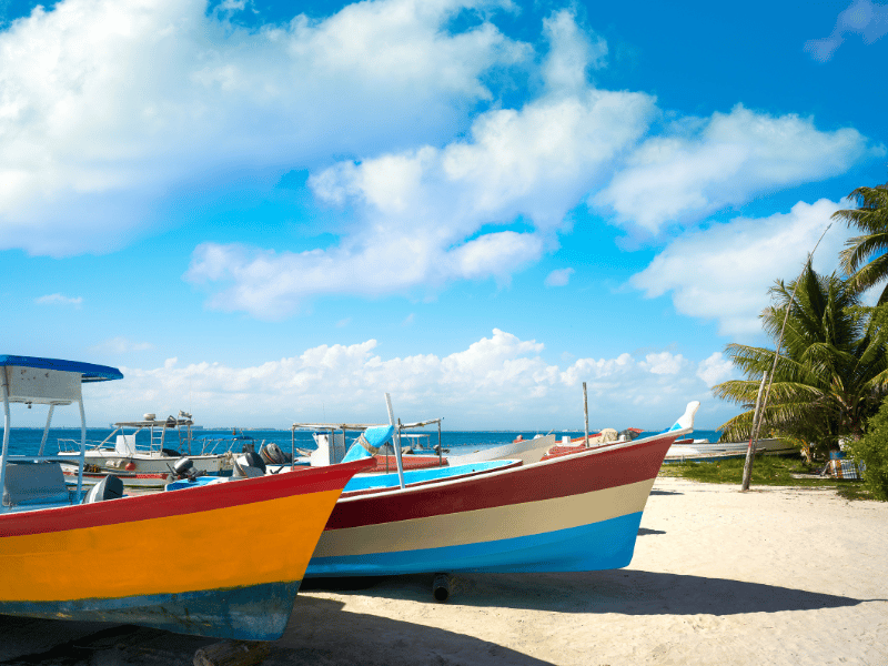 Colorful boats on the coast of Playa Mujeres, Mexico
