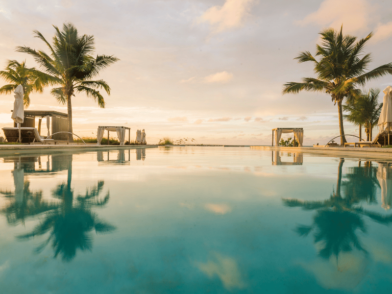 Still infinity pool at a resort during the sunset