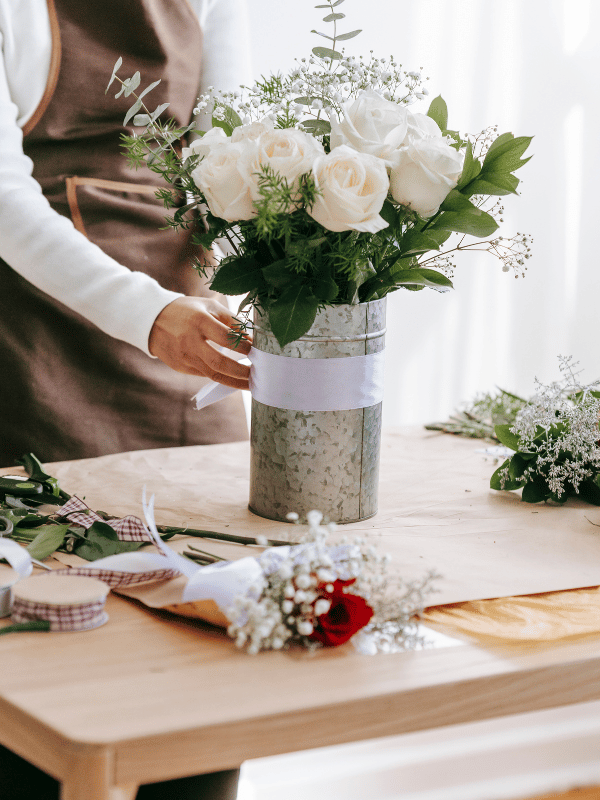 Florist prepares a bouquet for a destination wedding