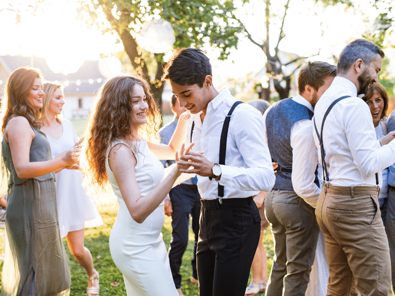 Wedding Guests dance at an outdoor wedding