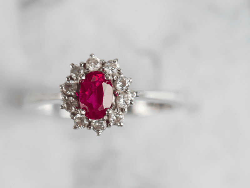 Ruby engagement ring with white diamond halo