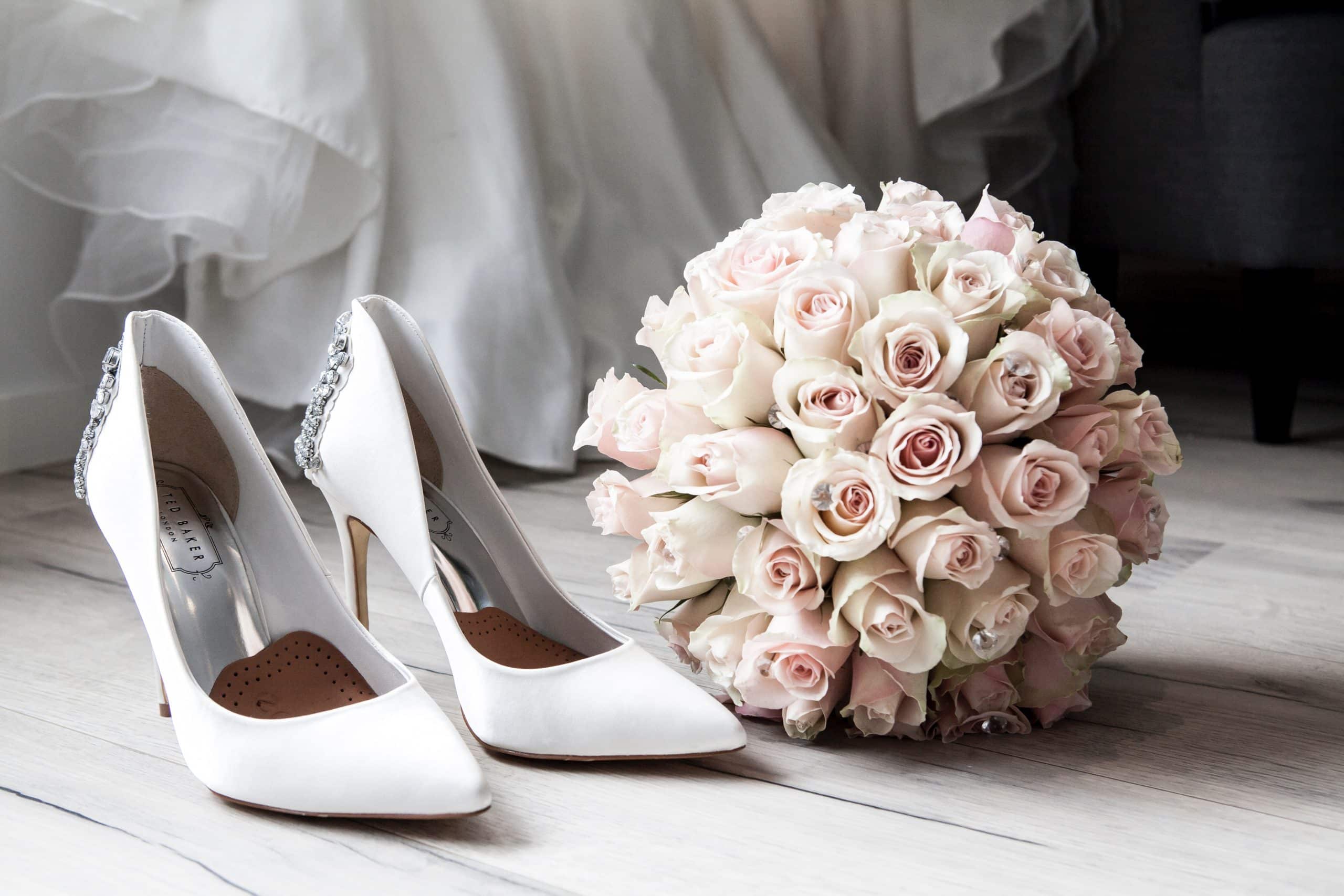 Close-up of wedding bouquet and shoes